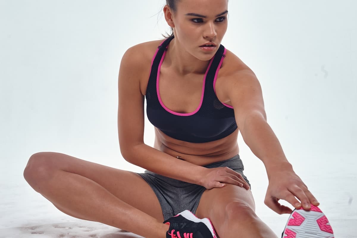 Person wearing wireless earbuds while running outdoors